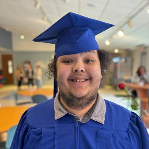Young man wearing blue regalia
