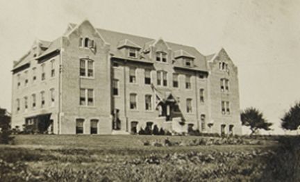 A vintage photo of a 3 story building