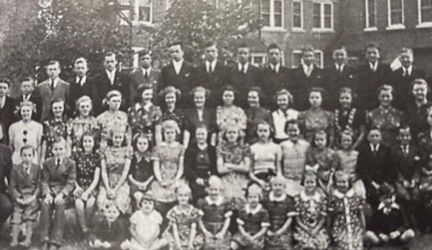 Orphans posing for a formal group photo together