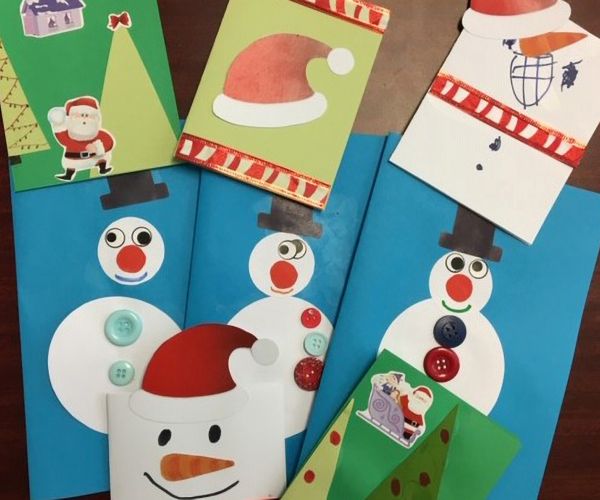 Winter themed, handmade cards, with snowman and Santa hats.