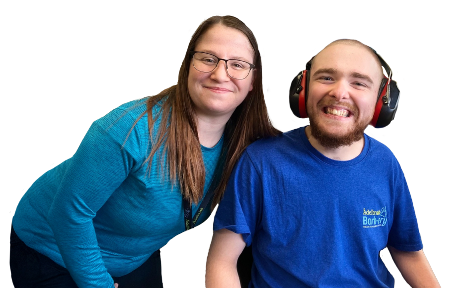 Adult woman and student smiling together for a photo