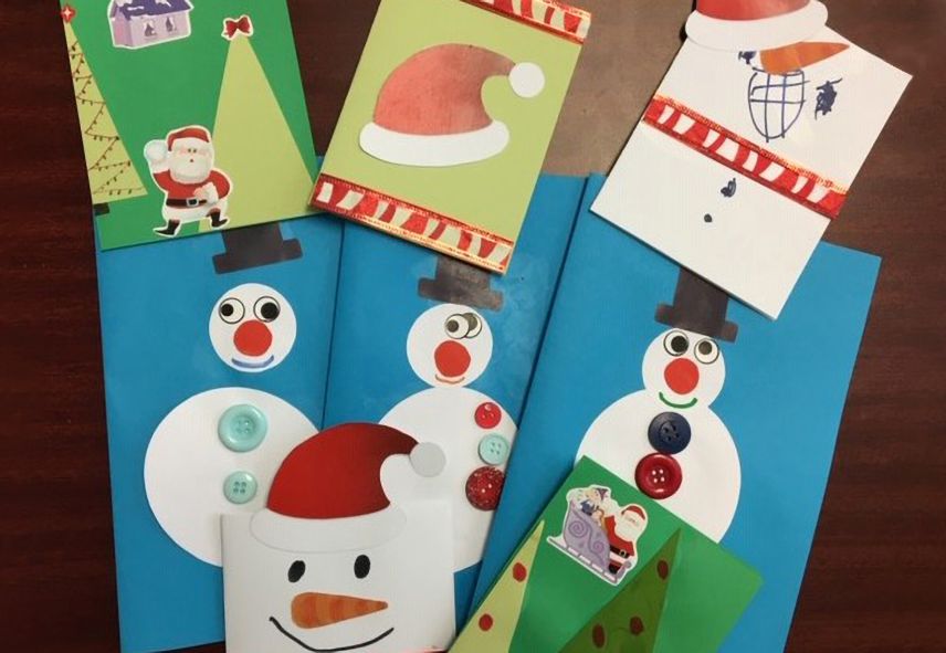 Winter themed, handmade cards, with snowman and Santa hats.